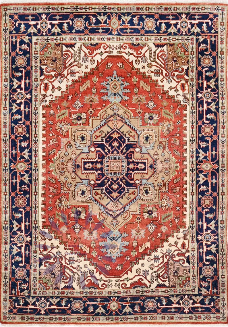 Hand-knotted Persian-style rug with a red geometric medallion, navy border, and intricate floral motifs