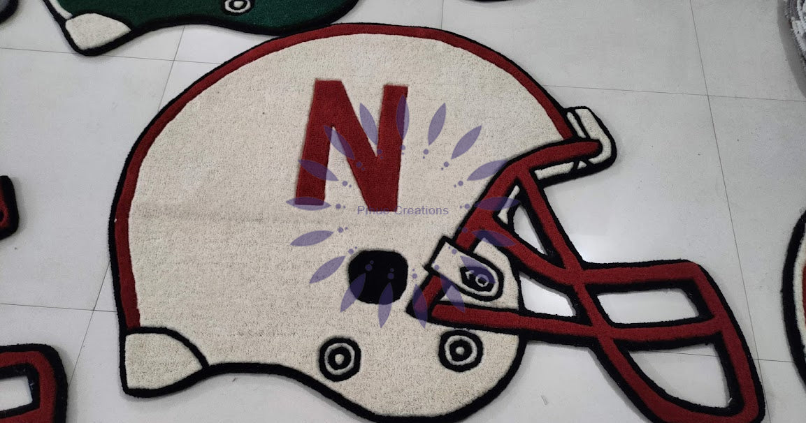 Custom handmade wool rug shaped as Tennessee Volunteers football helmet with orange T logo - 3D carved team logo rug for game room